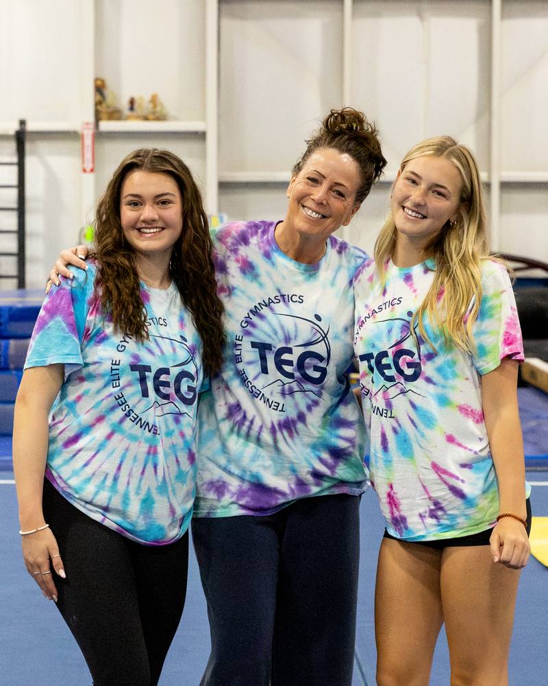 Three TEG coaches in tie-dye TEG shirts