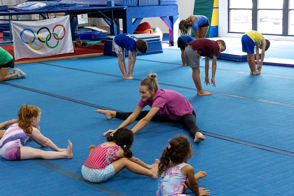 Kids stretching during a TEG class